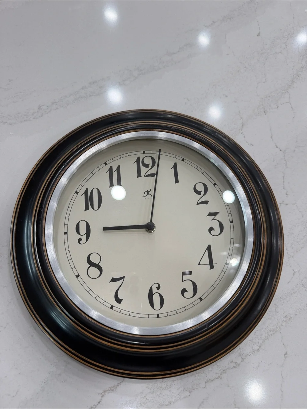 Classic Black Wall Clock with Antique Bronze Accents